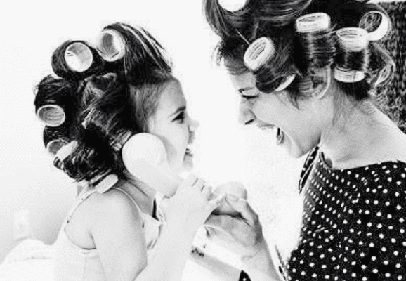 Mum and her daughter wearing curlers