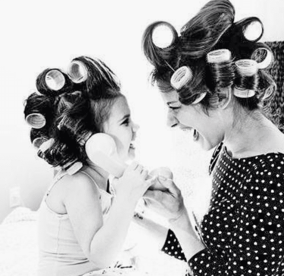 Mum and her daughter wearing curlers