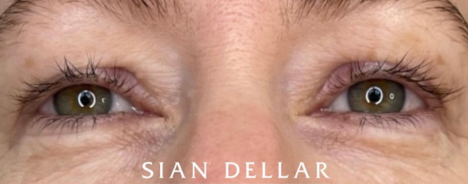 thin permanent eyeliner on top eyelid before